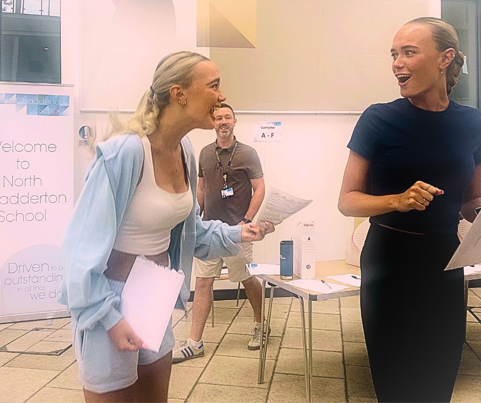 Identical twins Francesca and Danielle Hulme opening their results